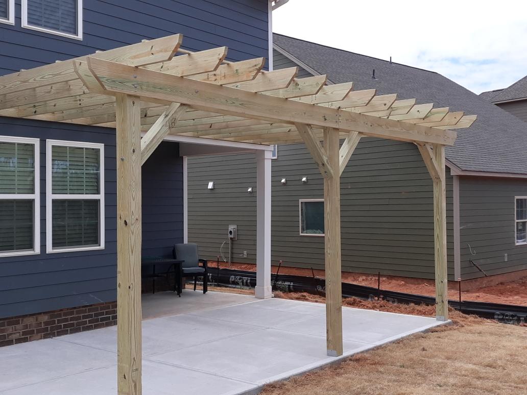 Custom pergola and outdoor structure built by Timberland Custom Builders